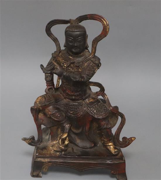 A Chinese bronze figure of a temple guardian height 27cm